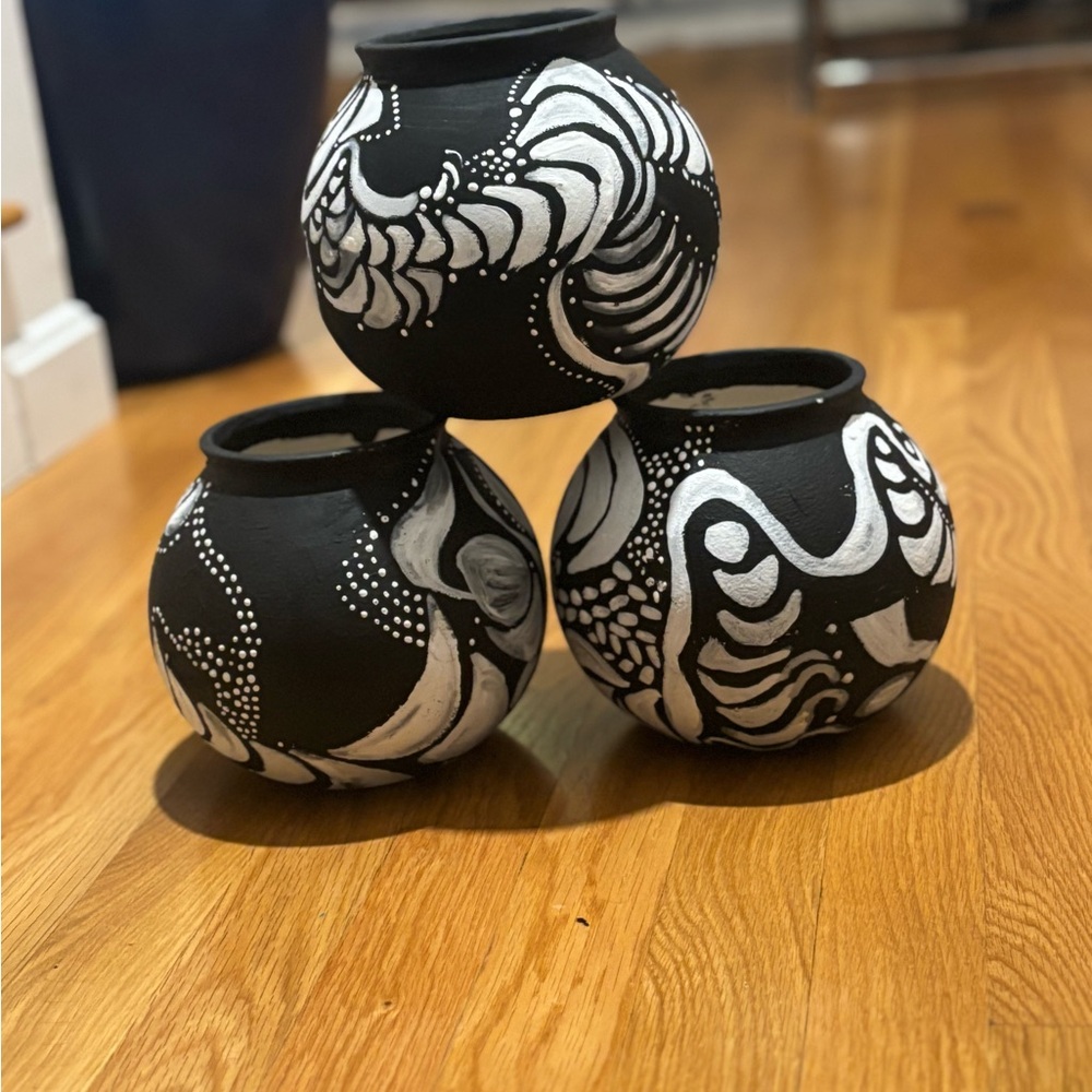 Hand painted one of a kind black and white ceramic vases. Set of three.